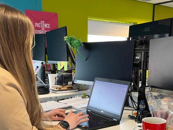 smiling man working at desk