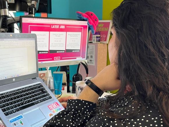 smiling woman working at desk