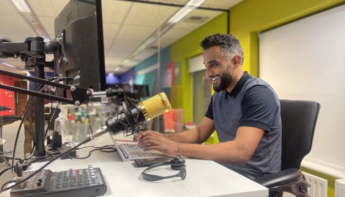 smiling man working at desk